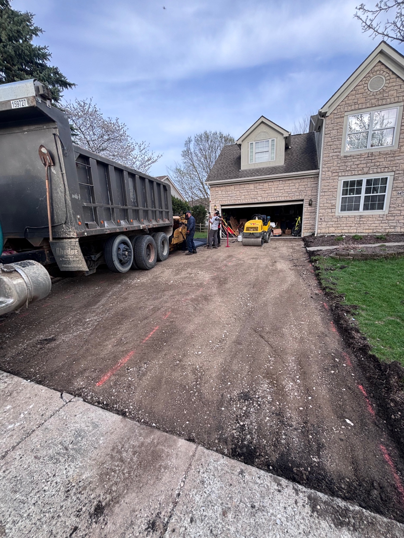 Cracked, weathered driveway before CrownCoat treatment